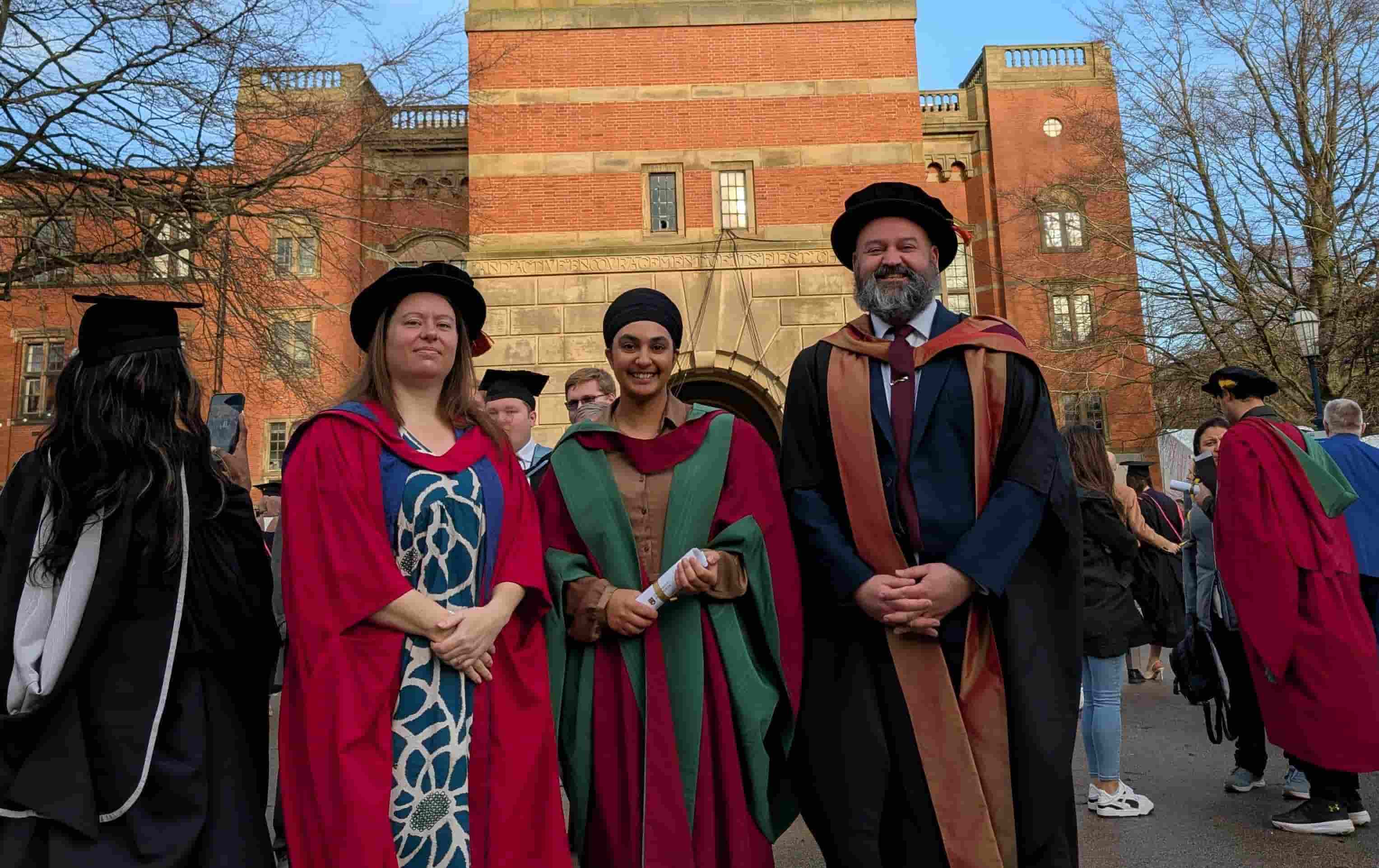 Dr Kylie Belchamber, Dr Mike Cox and Dr Karan Sandhu at her Graduation in academic dress